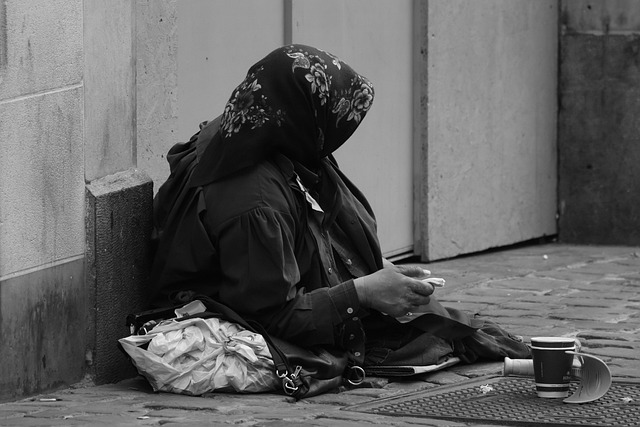 beggar in city-buildings-2